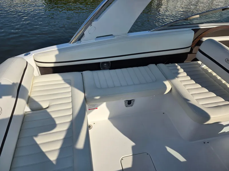Slide: The Image of 2015 Cobalt R7 boat interior with white leather seating by the water. - 5