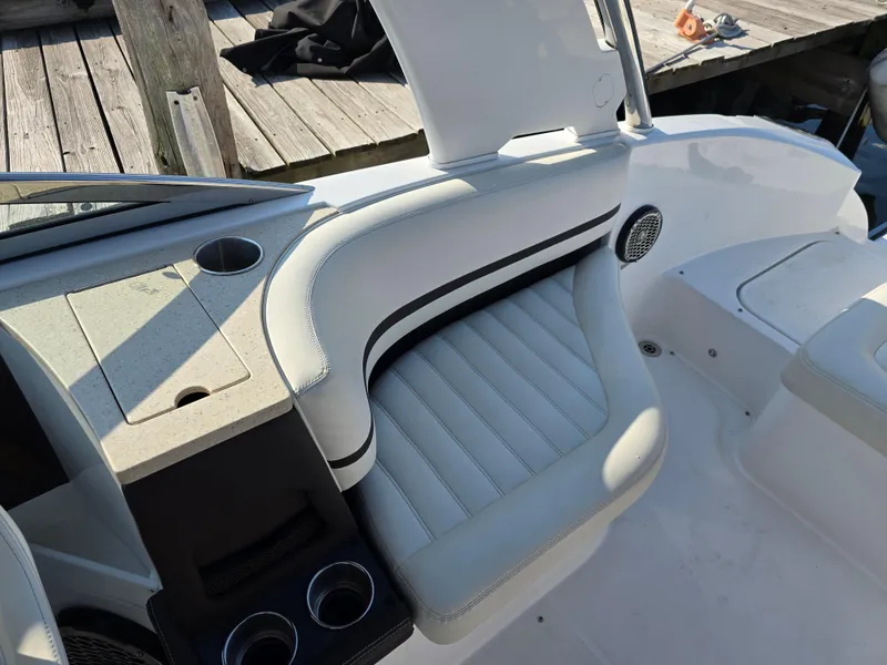 Slide: The Image of 2015 Cobalt R7 boat interior with white seating and cup holders. - 9