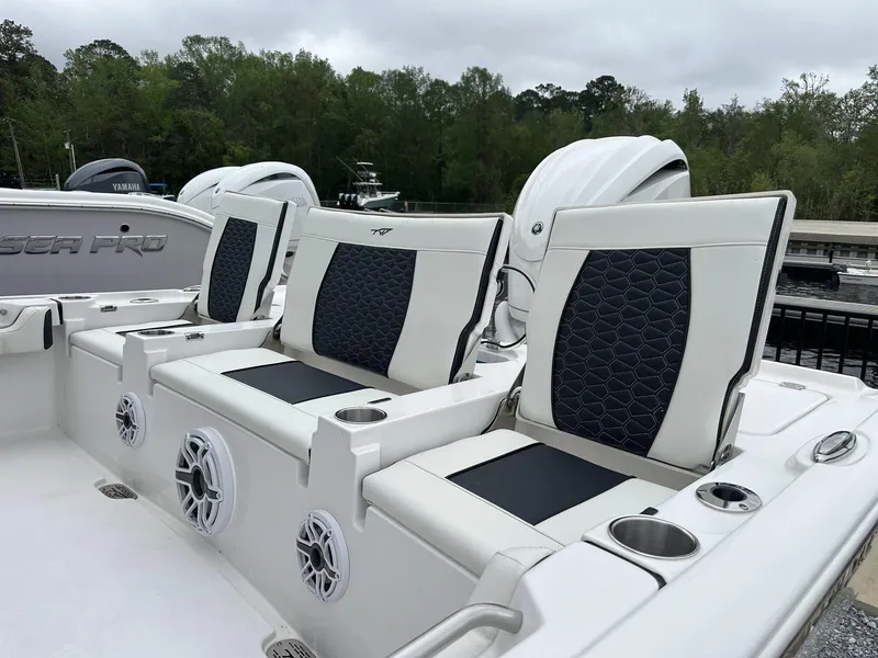 Slide: The Image of 2025 Tidewater 2500 Carolina Bay boat seats with cup holders and speakers. - 10