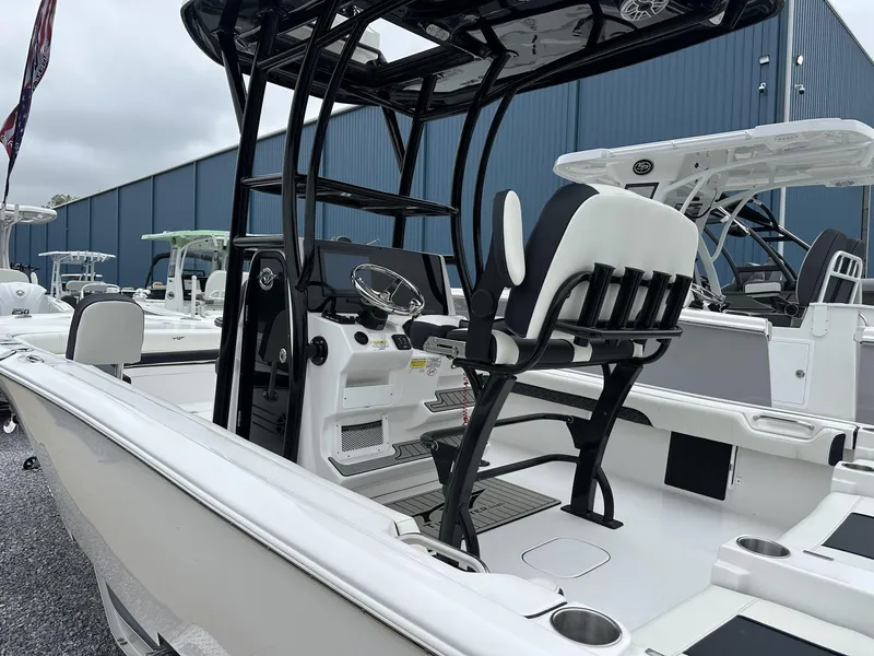 Slide: The Image of 2025 Tidewater 2500 Carolina Bay boat with second station, displayed outdoors. - 12