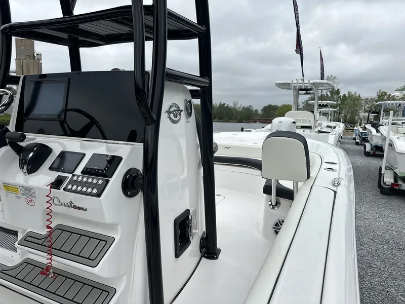 Slide: The Image of 2025 Tidewater 2500 Carolina Bay boat with second station, featuring modern controls and sleek design. - 18
