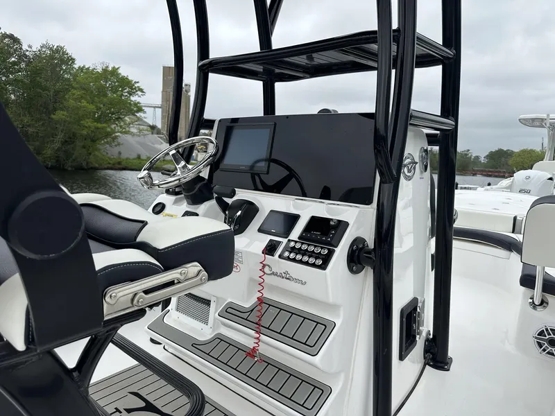 Slide: The Image of 2025 Tidewater 2500 Carolina Bay boat with second station, featuring modern controls and sleek design. - 20