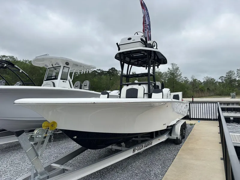 Slide: The Image of 2025 Tidewater 2500 Carolina Bay boat with second station on trailer, dockside. - 3