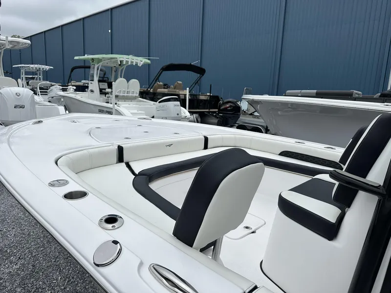 Slide: The Image of 2025 Tidewater 2500 Carolina Bay boat with second station, docked in a marina. - 6