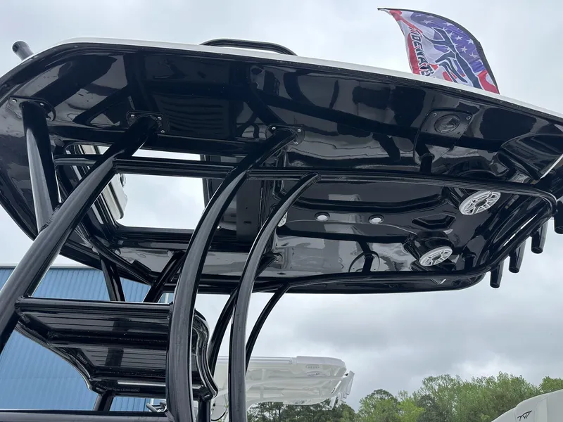 Slide: The Image of 2025 Tidewater 2500 Carolina Bay boat with second station, black structure, and speakers. - 7