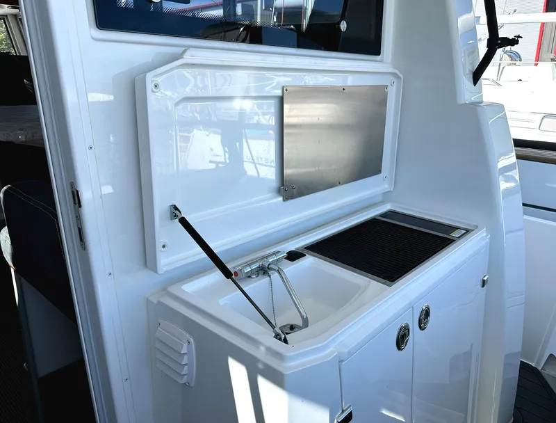 Slide: The Image of 2024 Sargo 36 Explorer boat interior with sink and storage area. - 20