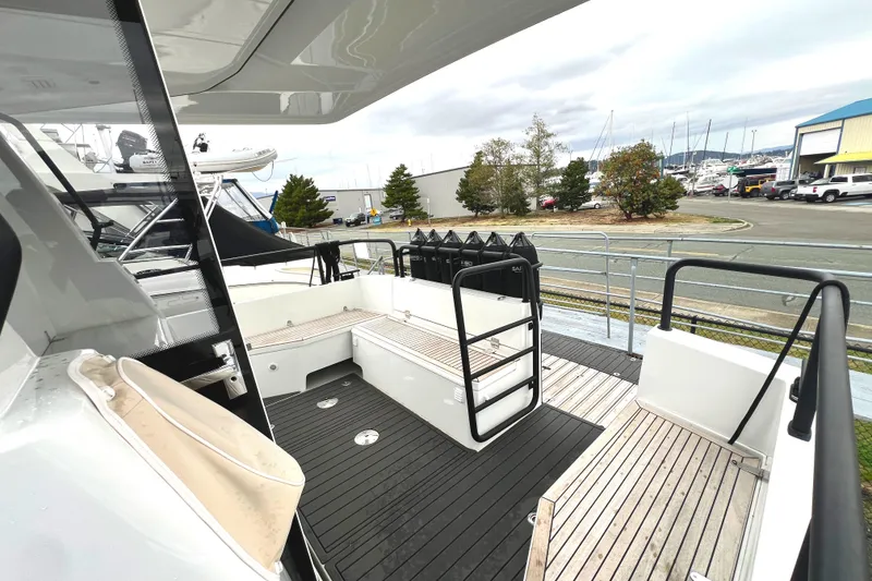 Slide: The Image of 2024 Sargo 36 Explorer yacht deck with modern seating and sleek design. - 22