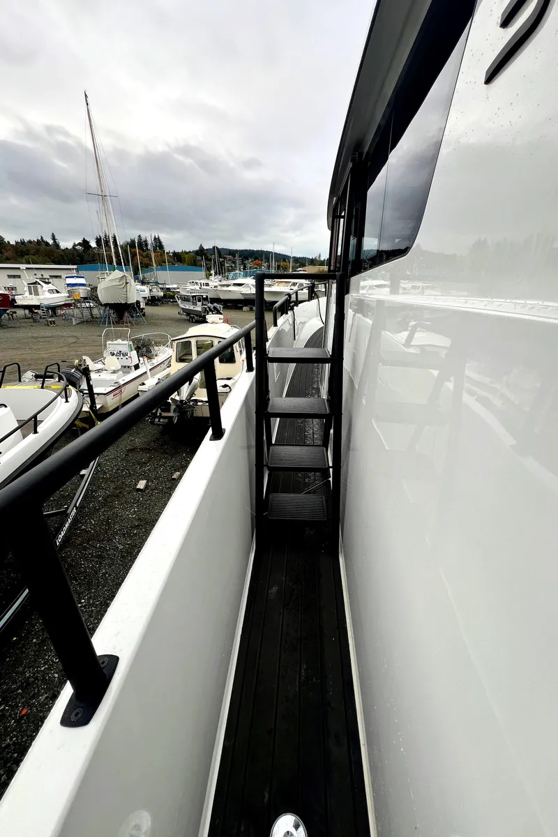 Slide: The Image of 2024 Sargo 36 Explorer boat deck with marina view. - 27