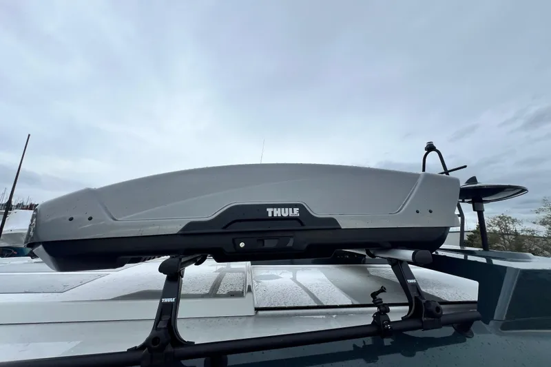 Slide: The Image of Thule roof box on Sargo 36 Explorer 2024, overcast sky background. - 30