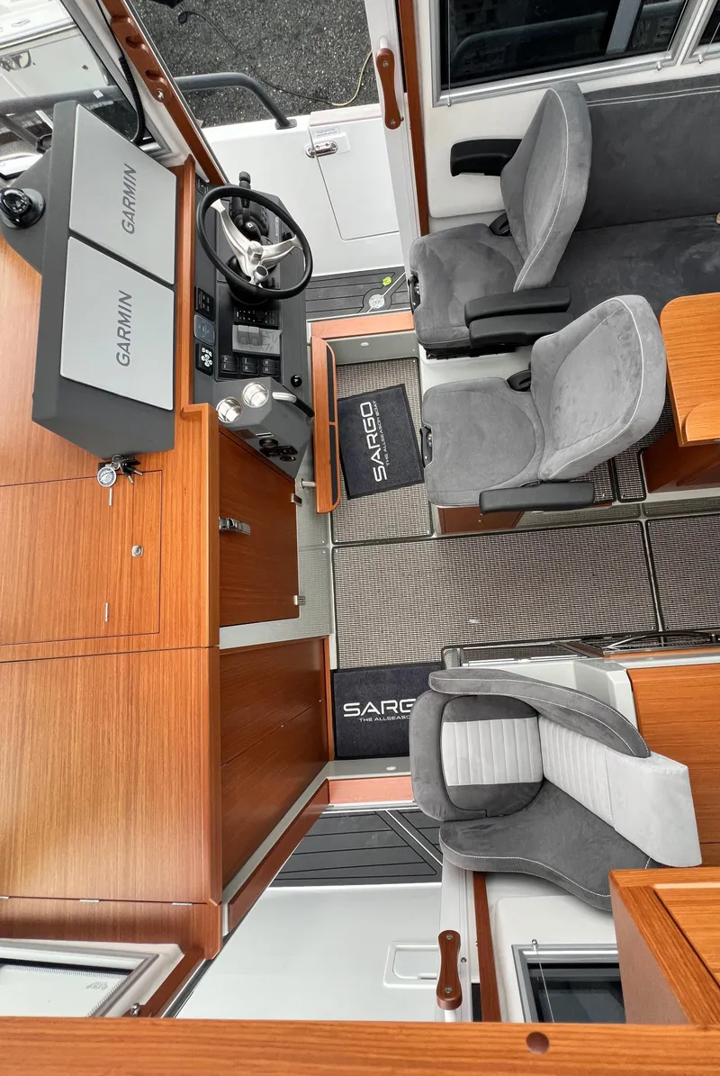 Slide: The Image of Interior of 2024 Sargo 36 Explorer boat with modern seating and navigation equipment. - 40