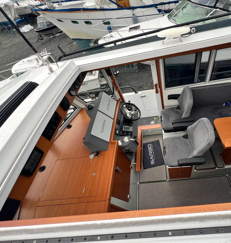 Slide: The Image of 2024 Sargo 36 Explorer boat interior with modern helm and seating. - 41