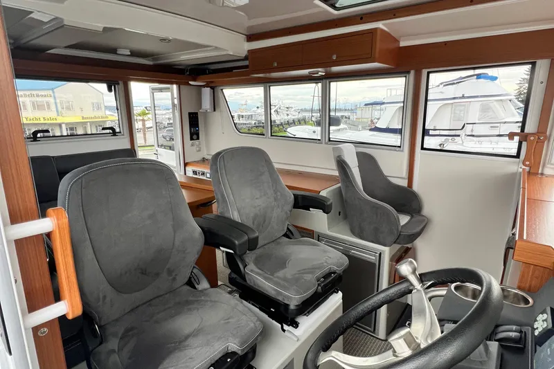 Slide: The Image of Interior of 2024 Sargo 36 Explorer boat with modern seating and steering wheel. - 44