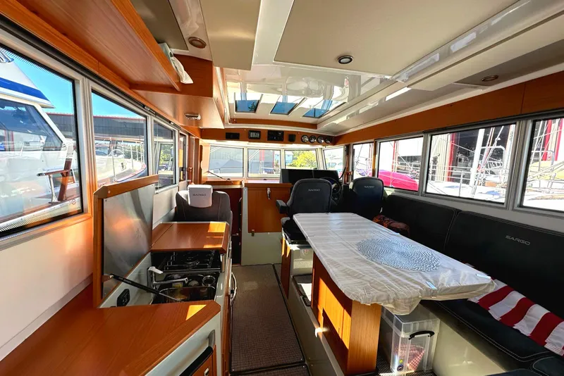 Slide: The Image of Interior of 2024 Sargo 36 Explorer boat with modern seating and dining area. - 46