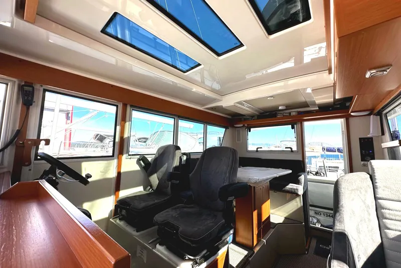 Slide: The Image of Interior of 2024 Sargo 36 Explorer boat with modern seating and large windows. - 48