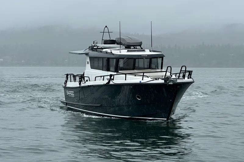 Slide: The Image of 2024 Sargo 36 Explorer boat navigating in misty waters. - 5