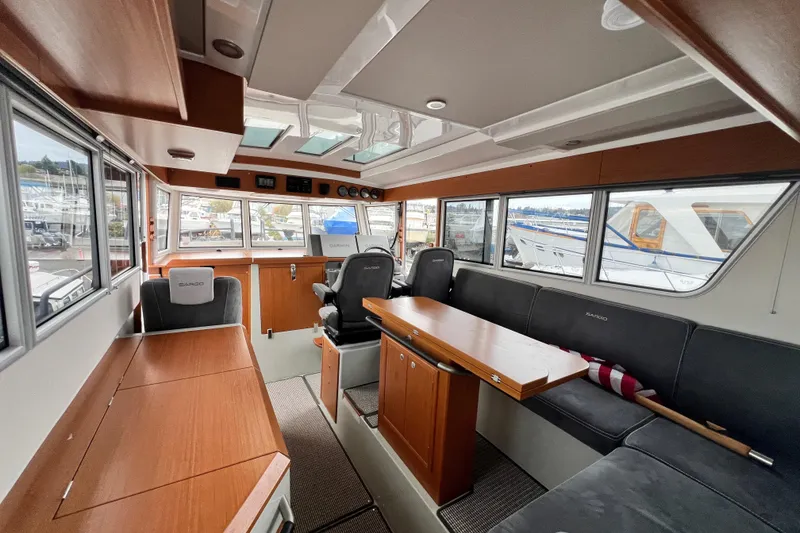 Slide: The Image of Interior of 2024 Sargo 36 Explorer boat with modern seating and wooden finishes. - 54