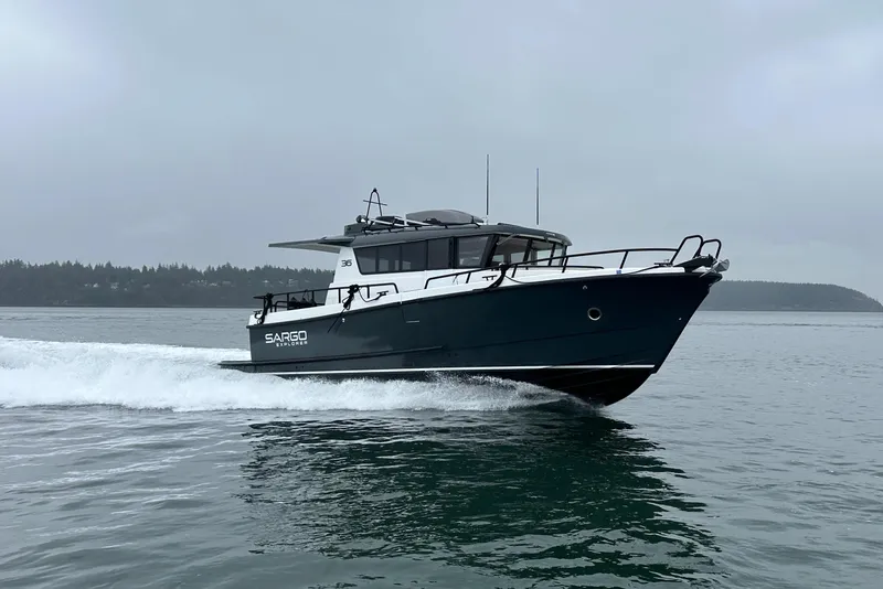 Slide: The Image of 2024 Sargo 36 Explorer cruising on a calm, overcast sea. - 7