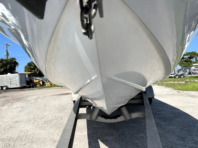 Slide: The Image of 2015 Contender 25 Bay boat on trailer, viewed from below. - 11