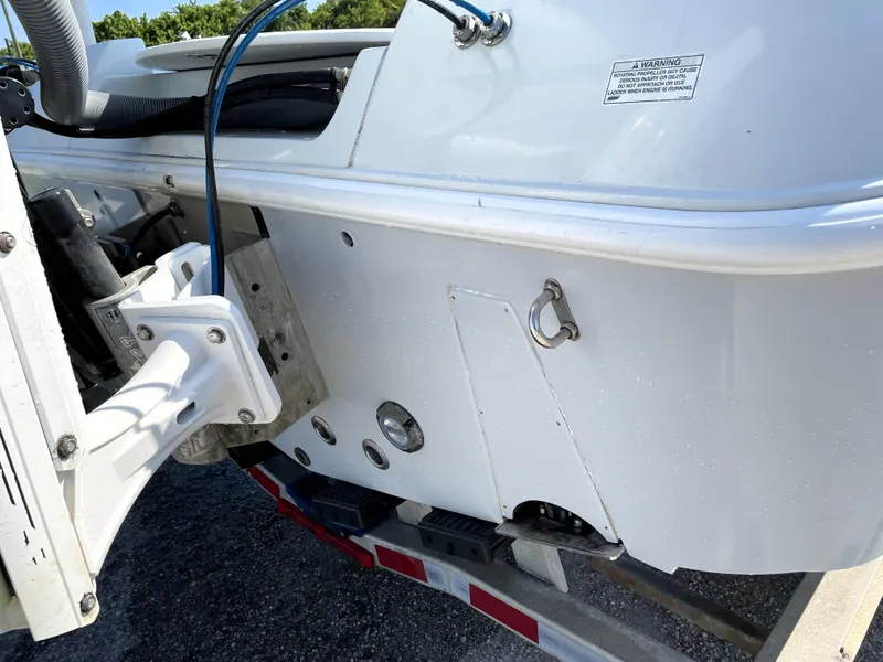 Slide: The Image of 2015 Contender 25 Bay boat on trailer, showing hull details and fittings. - 15