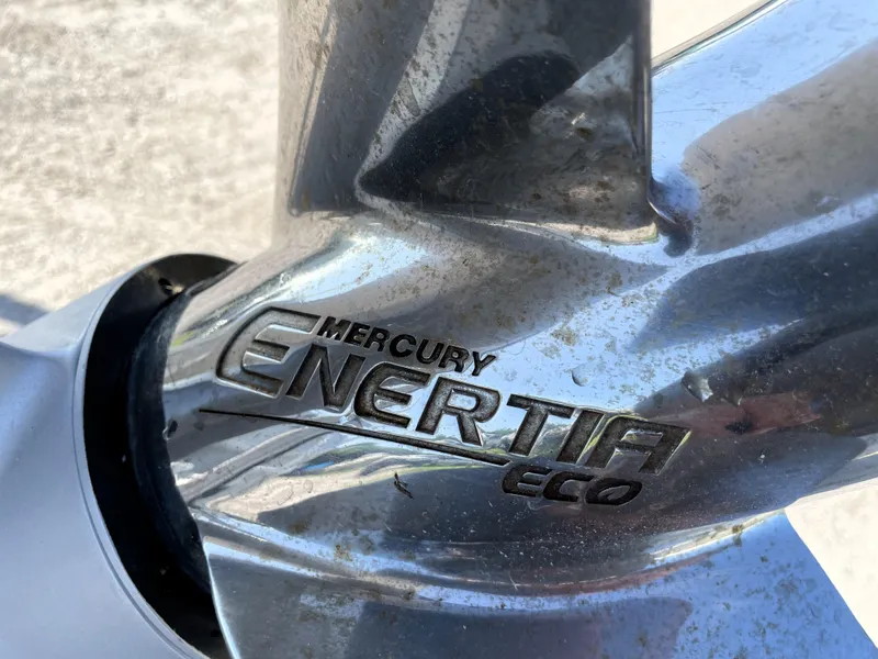 Slide: The Image of Mercury Enertia Eco propeller on 2015 Contender 25 Bay boat. - 19