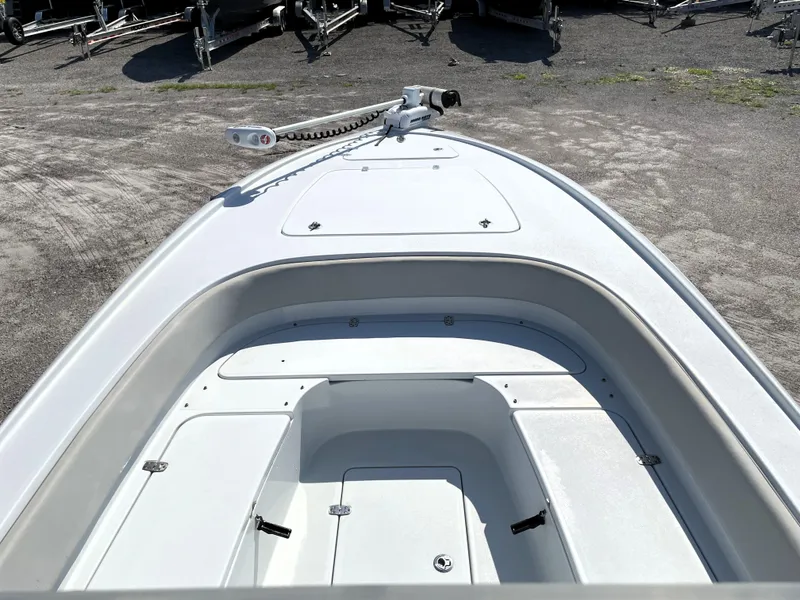 Slide: The Image of 2015 Contender 25 Bay boat deck with storage compartments and trolling motor. - 25