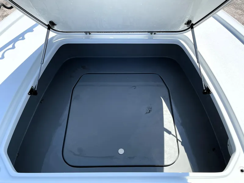 Slide: The Image of Open storage compartment of 2015 Contender 25 Bay boat. - 28