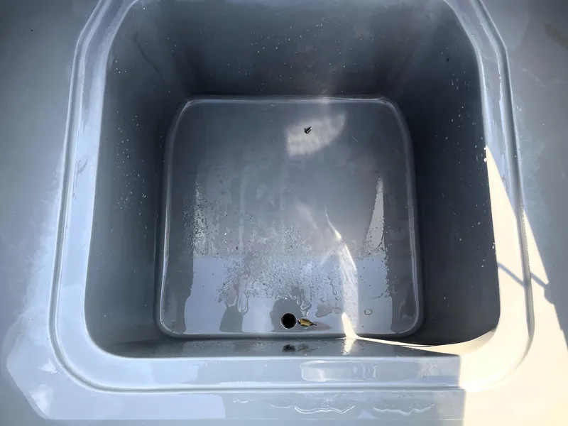 Slide: The Image of Contender 25 Bay 2015 boat storage compartment, empty and clean. - 29