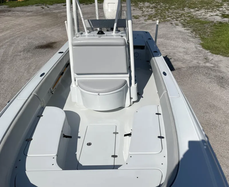 Slide: The Image of 2015 Contender 25 Bay boat interior with seating and storage compartments. - 33