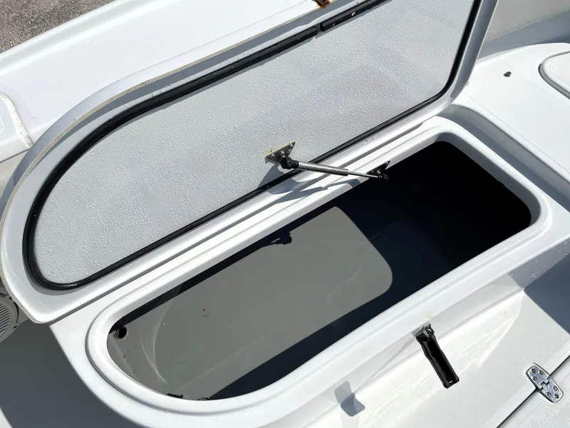 Slide: The Image of Open storage compartment on 2015 Contender 25 Bay boat. - 35