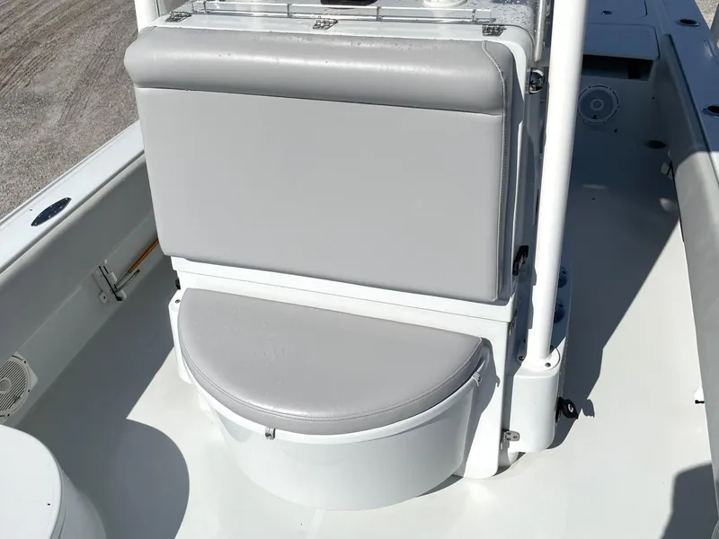 Slide: The Image of 2015 Contender 25 Bay boat with gray cushioned seating. - 38