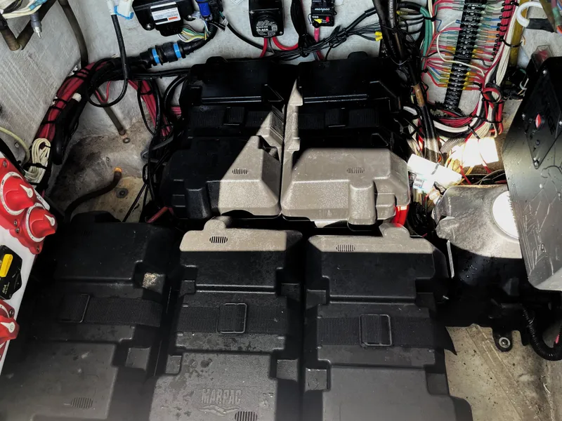 Slide: The Image of 2015 Contender 25 Bay boat battery compartment with wiring and electrical components. - 41
