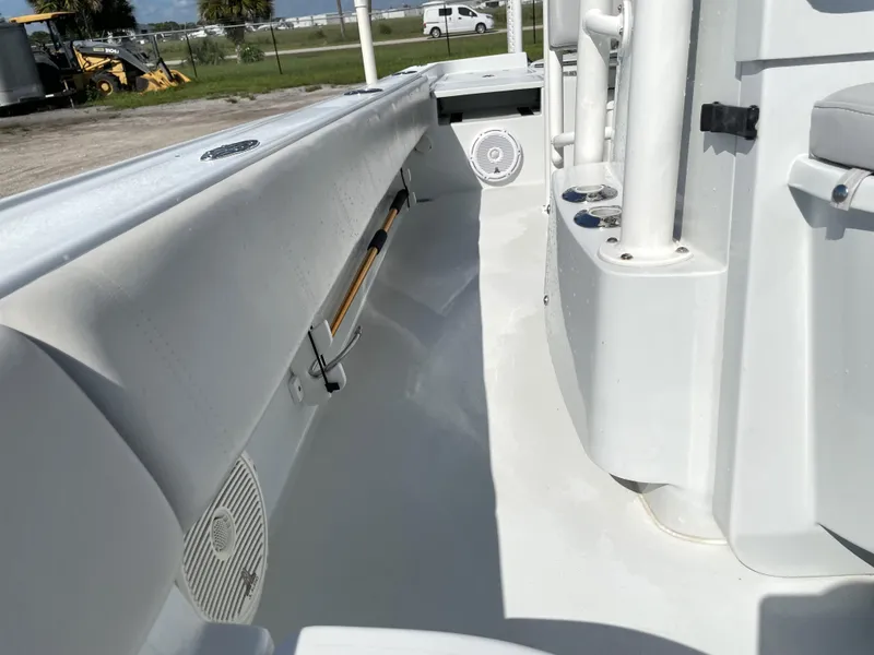 Slide: The Image of 2015 Contender 25 Bay boat interior, featuring white deck and built-in speakers. - 45