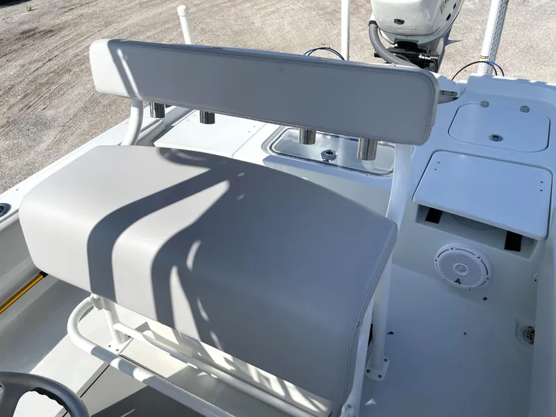 Slide: The Image of 2015 Contender 25 Bay boat interior with seating and console details. - 49