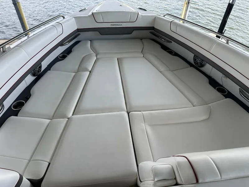 Slide: The Image of 2016 Formula 330 Crossover Bowrider with spacious seating and sleek design on the water. - 12