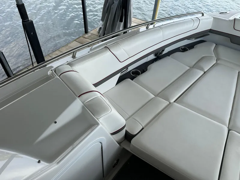 Slide: The Image of 2016 Formula 330 Crossover Bowrider with spacious white seating and sleek design. - 14