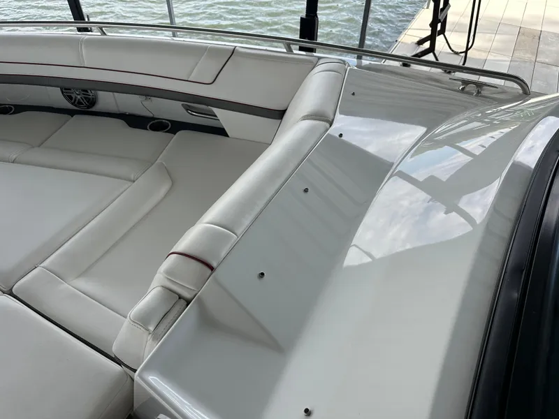 Slide: The Image of 2016 Formula 330 Crossover Bowrider with sleek white seating and modern design. - 15