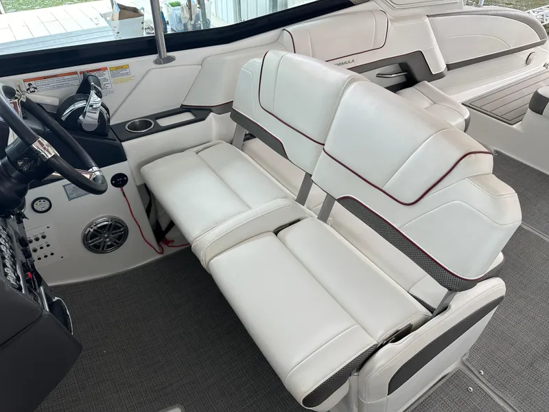 Slide: The Image of 2016 Formula 330 Crossover Bowrider interior with white leather seating and modern dashboard. - 17