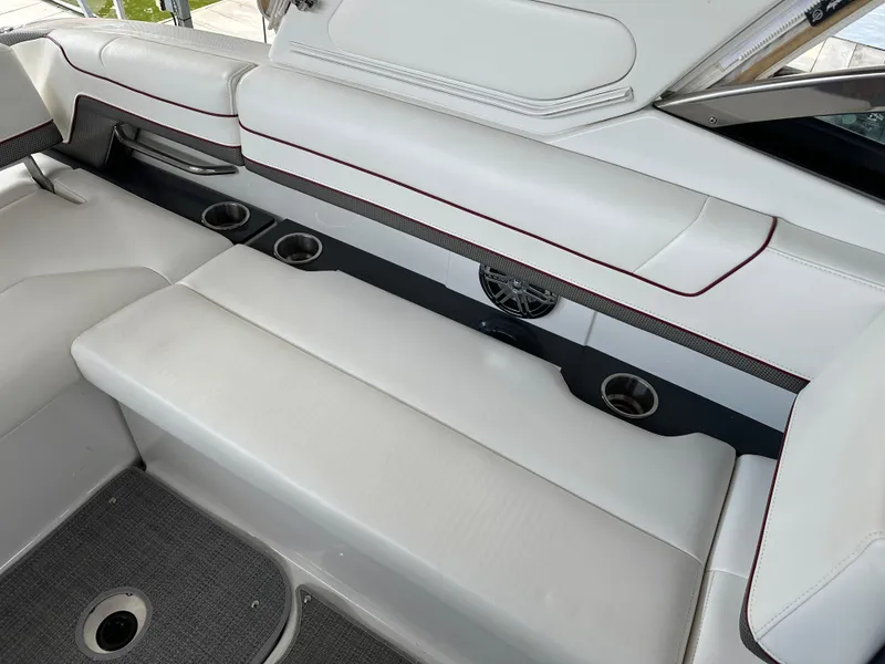 Slide: The Image of 2016 Formula 330 Crossover Bowrider interior with white seating and cup holders. - 18
