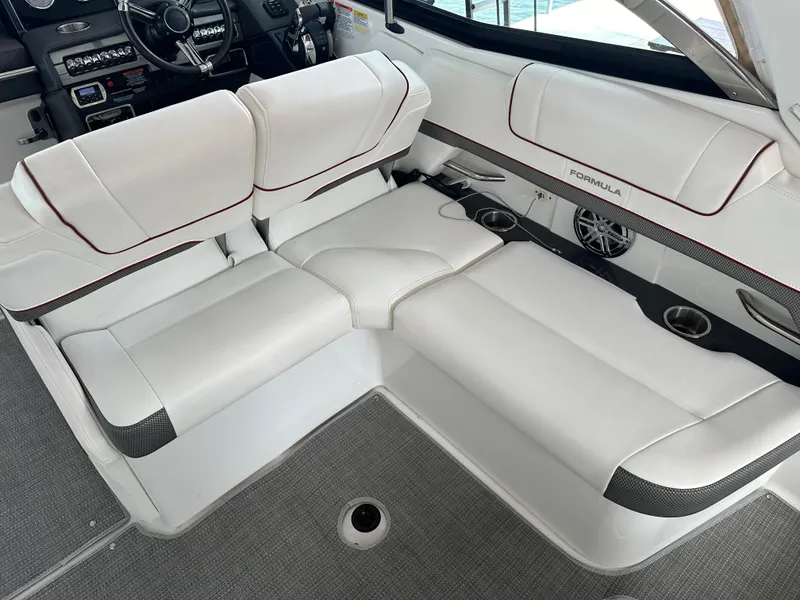 Slide: The Image of 2016 Formula 330 Crossover Bowrider interior with white leather seating and modern dashboard. - 19