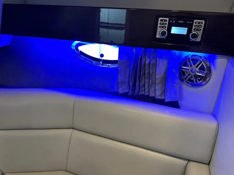 Slide: The Image of Interior of 2016 Formula 330 Crossover Bowrider with blue LED lighting and audio system. - 21