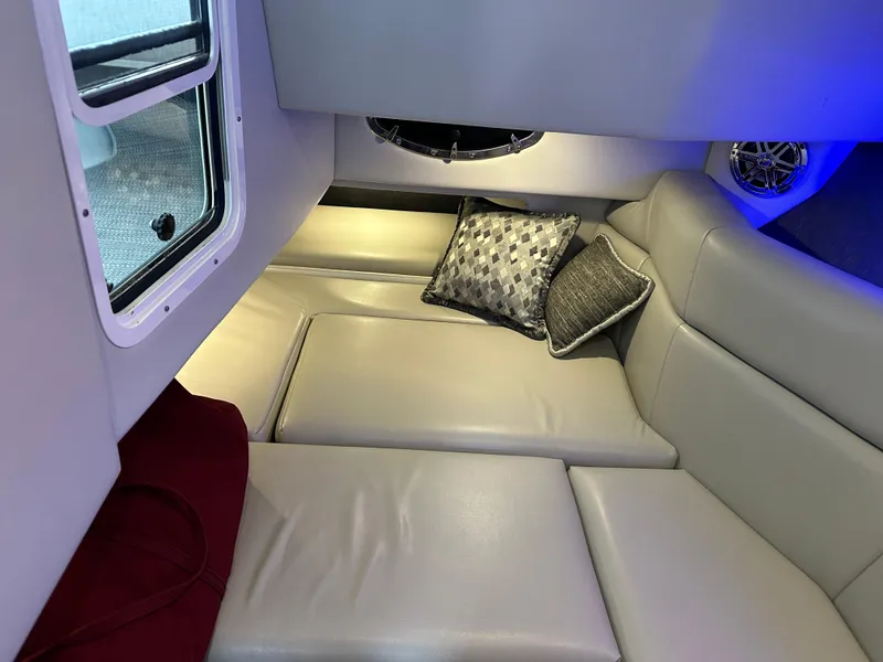Slide: The Image of 2016 Formula 330 Crossover Bowrider cabin interior with plush seating and decorative pillows. - 23