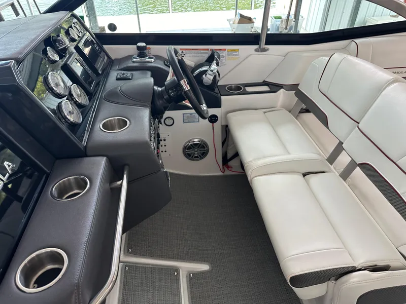 Slide: The Image of Interior of 2016 Formula 330 Crossover Bowrider with steering wheel and seating. - 26