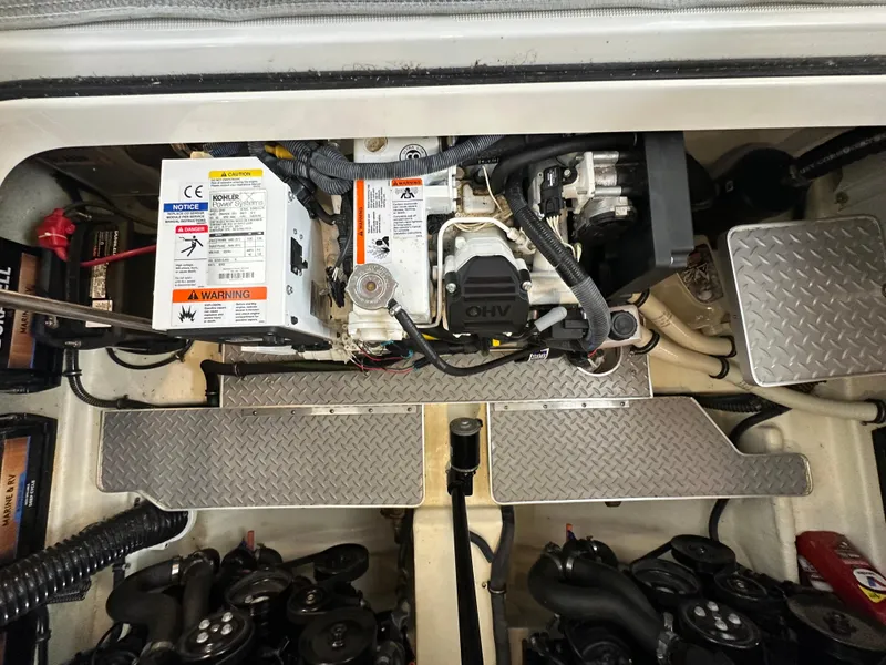 Slide: The Image of Engine compartment of 2016 Formula 330 Crossover Bowrider with visible components and wiring. - 30