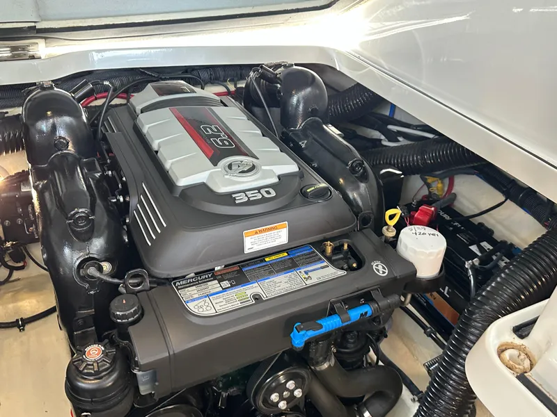 Slide: The Image of 2016 Formula 330 Crossover Bowrider engine compartment with Mercury 350 engine. - 32