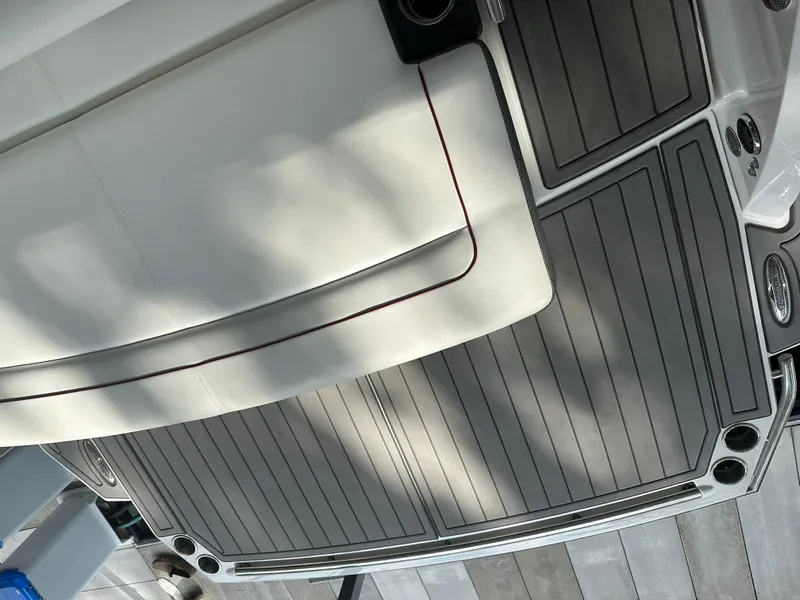 Slide: The Image of 2016 Formula 330 Crossover Bowrider interior with sleek seating and flooring design. - 36