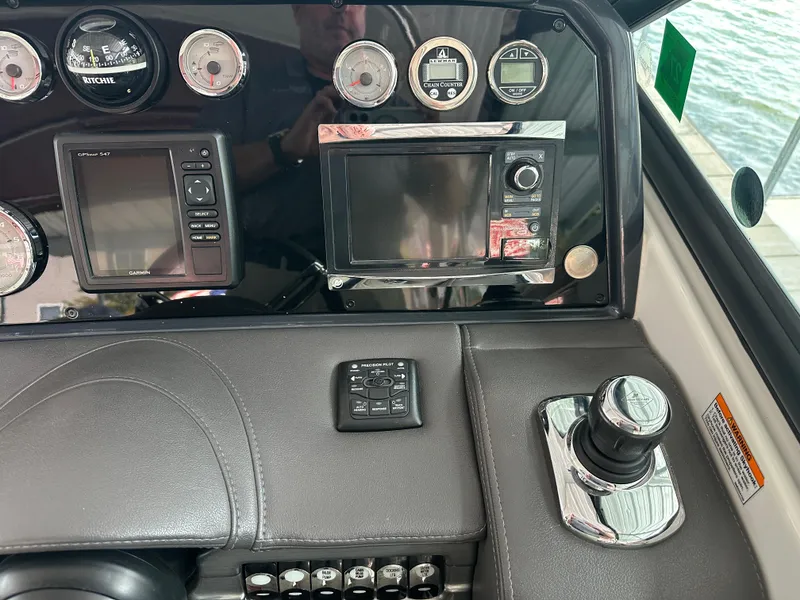 Slide: The Image of Dashboard of 2016 Formula 330 Crossover Bowrider with navigation controls and gauges. - 4