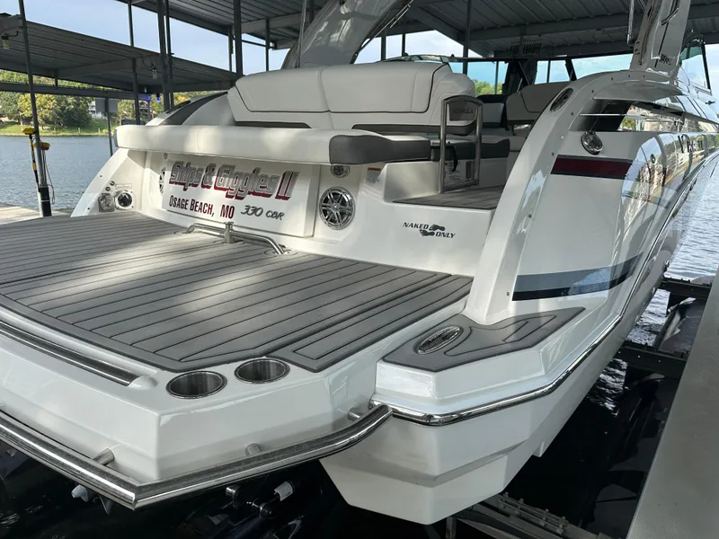 Slide: The Image of 2016 Formula 330 Crossover Bowrider docked, featuring spacious deck and sleek design. - 40