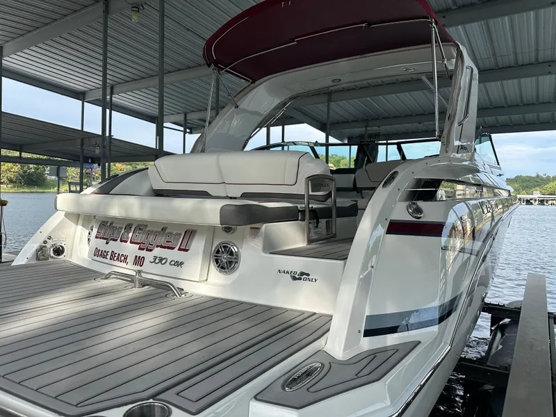 Slide: The Image of 2016 Formula 330 Crossover Bowrider docked under a covered marina. - 41