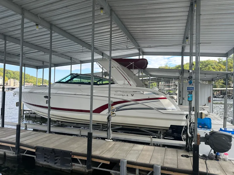Slide: The Image of 2016 Formula 330 Crossover Bowrider docked in a covered marina. - 42