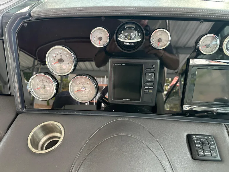 Slide: The Image of Dashboard of 2016 Formula 330 Crossover Bowrider with gauges and navigation system. - 5